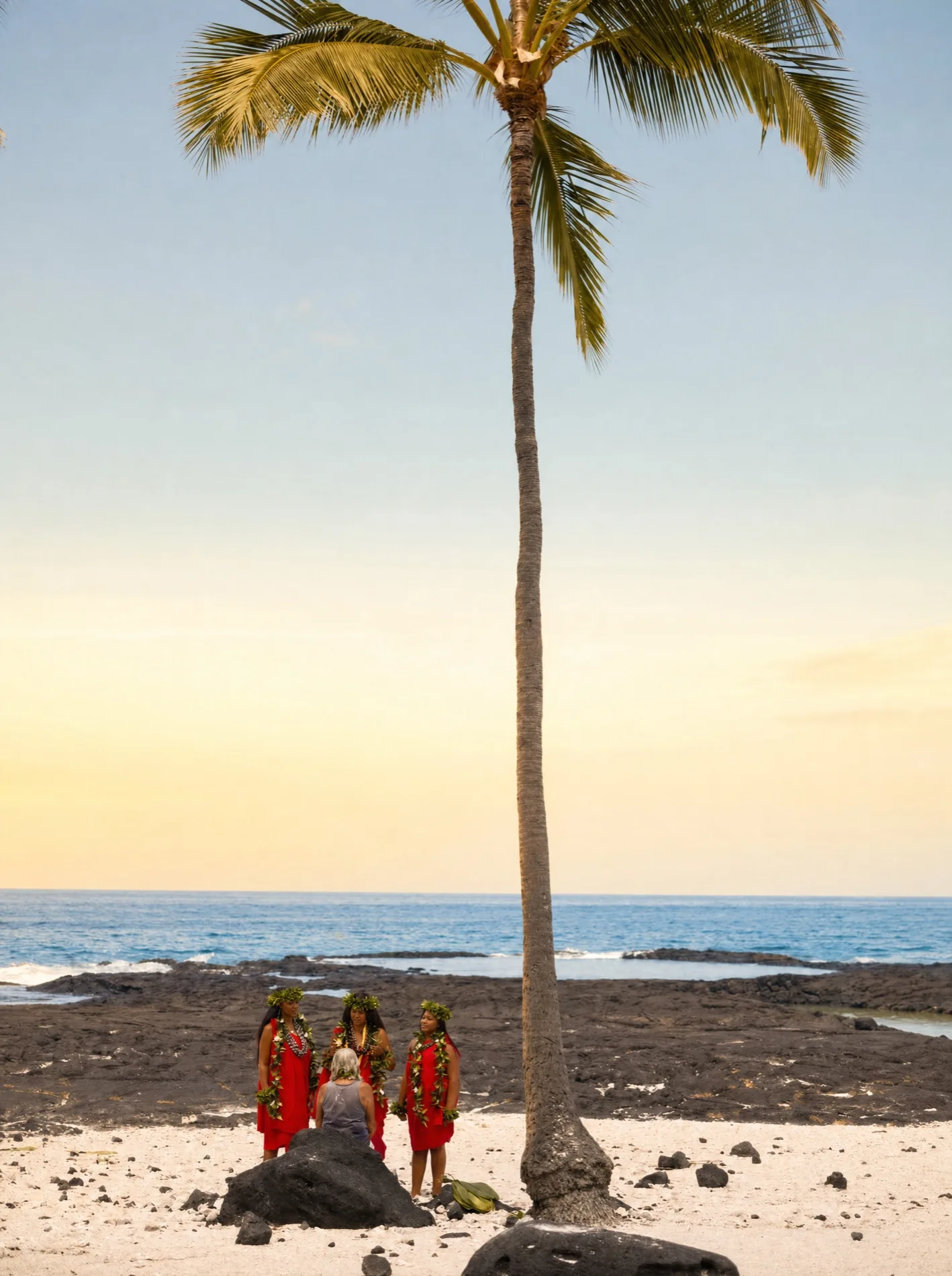 Three generations of Kāhealani's family on the black lava shore